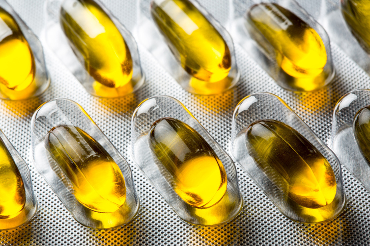 Golden,Oil,Viltamin,Pill,-,Close,Up